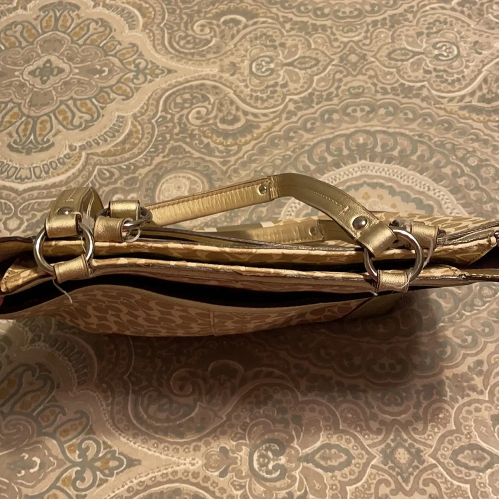 Gold coach purse with lavender inside